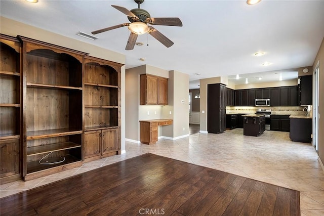 39766 Pinedale Way, Murrieta, CA 92562 - unfurnished living room featuring ceiling fan, light tile patterned floors, and recessed lighting