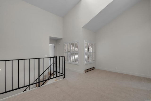 22 Seaview Dr S, Rolling Hills Estates, CA 90274 - spare room with baseboard heating, carpet floors, baseboards, and high vaulted ceiling