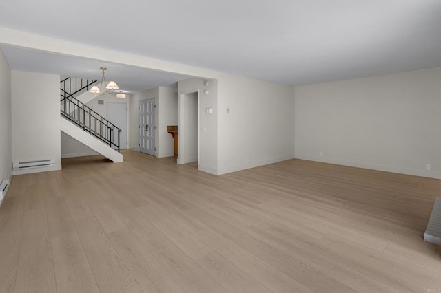 22 Seaview Dr S, Rolling Hills Estates, CA 90274 - unfurnished living room featuring stairs, light wood-style flooring, baseboards, baseboard heating, and a chandelier