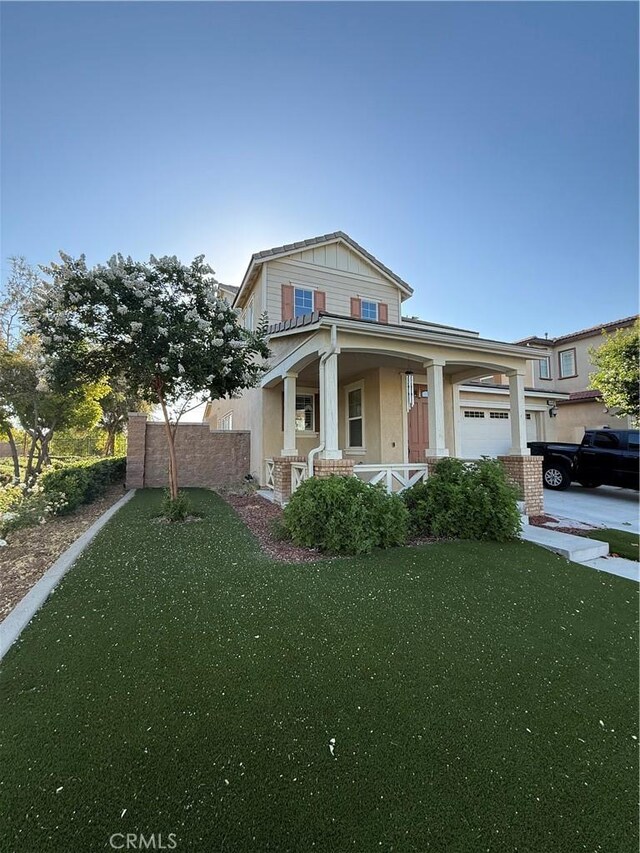 14450 Willamette Ave, Chino, CA 91710 - craftsman house featuring covered porch, a garage, and stucco siding