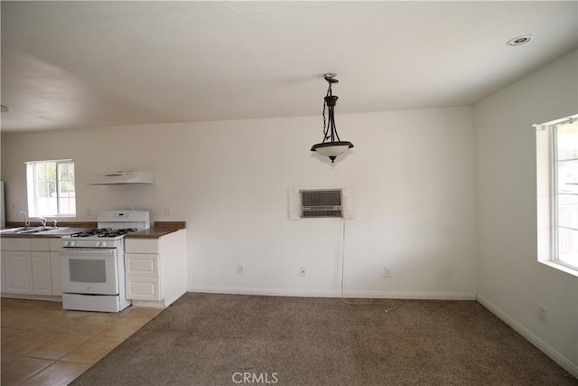 509 E Williams St, Yermo, CA 92398 - kitchen featuring white gas range oven, extractor fan, white cabinetry, and light carpet