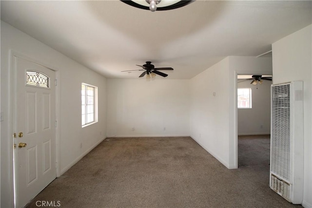 509 E Williams St, Yermo, CA 92398 - carpeted spare room with a heating unit, a ceiling fan, and baseboards