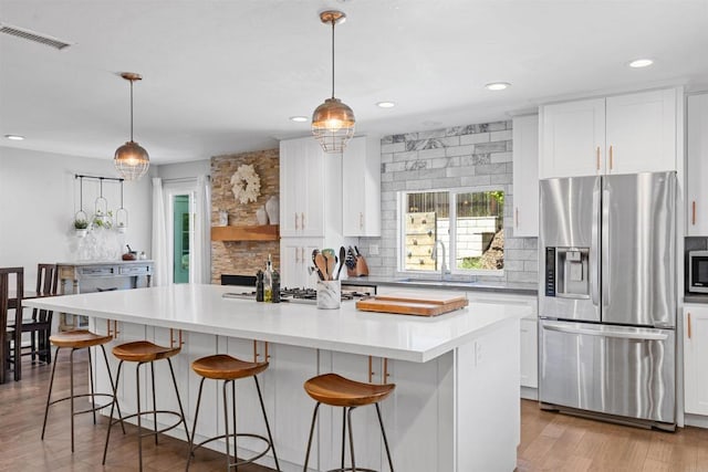 2528 Windmill View Rd, El Cajon, CA 92020 - kitchen featuring appliances with stainless steel finishes, a sink, decorative backsplash, white cabinetry, and recessed lighting