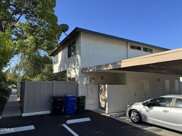 1797 E Avenida De Las Flores, Thousand Oaks, CA 91362 - view of home's exterior featuring stucco siding and uncovered parking