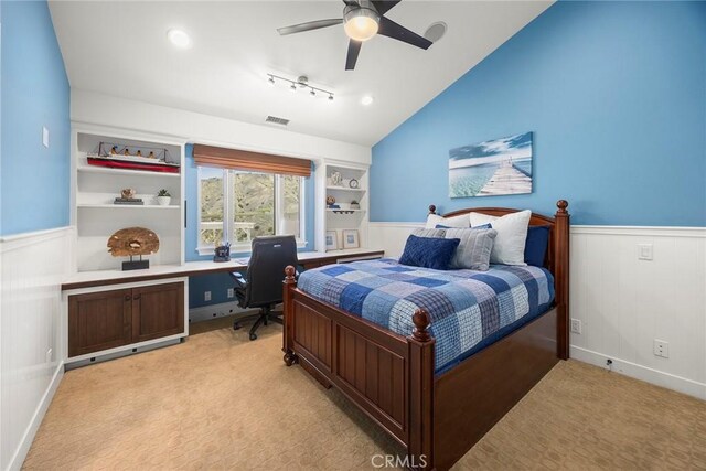 21925 Heatheridge Dr, Yorba Linda, CA 92887 - bedroom with wainscoting, lofted ceiling, light carpet, rail lighting, and a ceiling fan