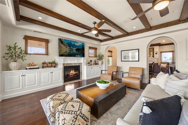 21925 Heatheridge Dr, Yorba Linda, CA 92887 - living area featuring ceiling fan, arched walkways, healthy amount of natural light, beam ceiling, and recessed lighting