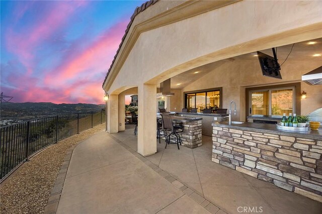 21925 Heatheridge Dr, Yorba Linda, CA 92887 - patio terrace at dusk with an outdoor kitchen and a patio