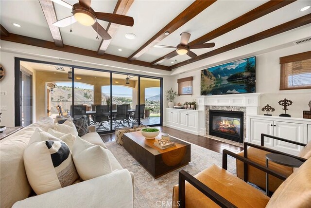 21925 Heatheridge Dr, Yorba Linda, CA 92887 - living area with ceiling fan, wood finished floors, beam ceiling, a high end fireplace, and recessed lighting