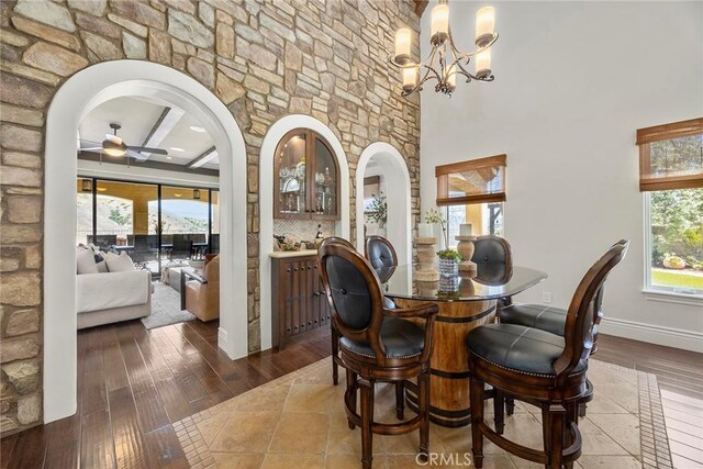 21925 Heatheridge Dr, Yorba Linda, CA 92887 - dining room with arched walkways, a ceiling fan, hardwood / wood-style flooring, and a chandelier