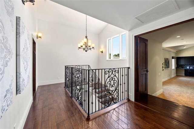 21925 Heatheridge Dr, Yorba Linda, CA 92887 - hallway with vaulted ceiling, an upstairs landing, a chandelier, hardwood / wood-style floors, and baseboards