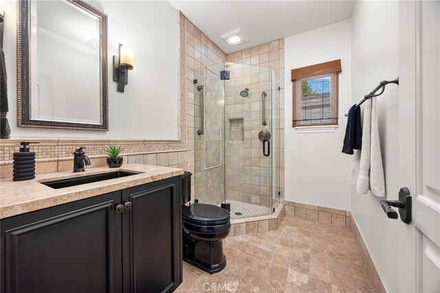 21925 Heatheridge Dr, Yorba Linda, CA 92887 - bathroom with baseboards, vanity, a shower stall, stone finish floors, and toilet