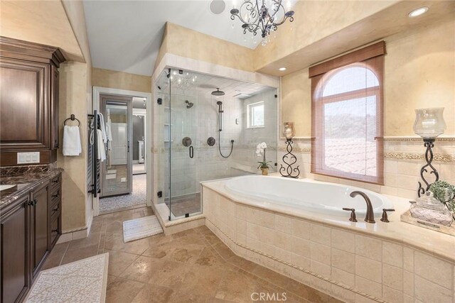 21925 Heatheridge Dr, Yorba Linda, CA 92887 - bathroom featuring a bath, a stall shower, vanity, a chandelier, and tile patterned floors