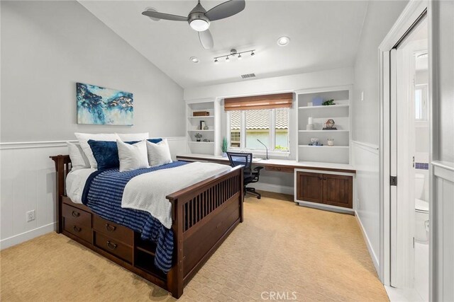 21925 Heatheridge Dr, Yorba Linda, CA 92887 - bedroom featuring light carpet, vaulted ceiling, a wainscoted wall, a ceiling fan, and a decorative wall