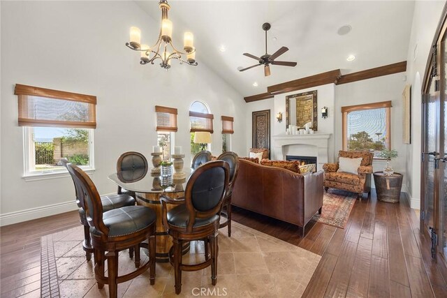 21925 Heatheridge Dr, Yorba Linda, CA 92887 - dining area with wood-type flooring, healthy amount of natural light, a chandelier, a lit fireplace, and vaulted ceiling