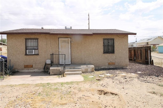 120 W Williams St, Barstow, CA 92311 - rear view of house featuring stucco siding and crawl space