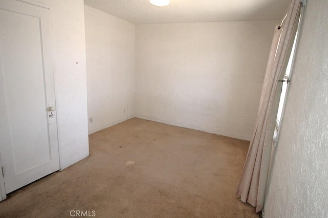 120 W Williams St, Barstow, CA 92311 - spare room with light carpet