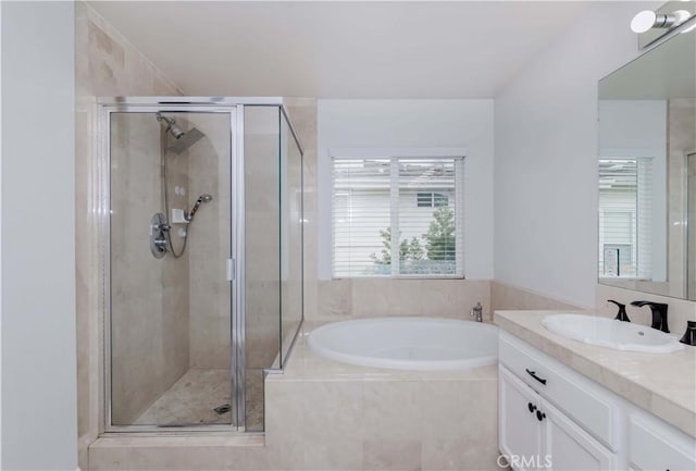 5612 Sprague Ave, Cypress, CA 90630 - full bathroom featuring vanity, a bath, plenty of natural light, and a stall shower