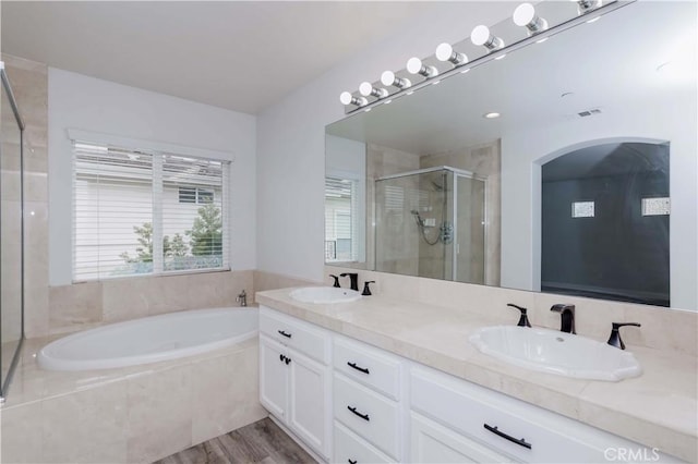 5612 Sprague Ave, Cypress, CA 90630 - bathroom with a shower stall, a garden tub, double vanity, and wood finished floors