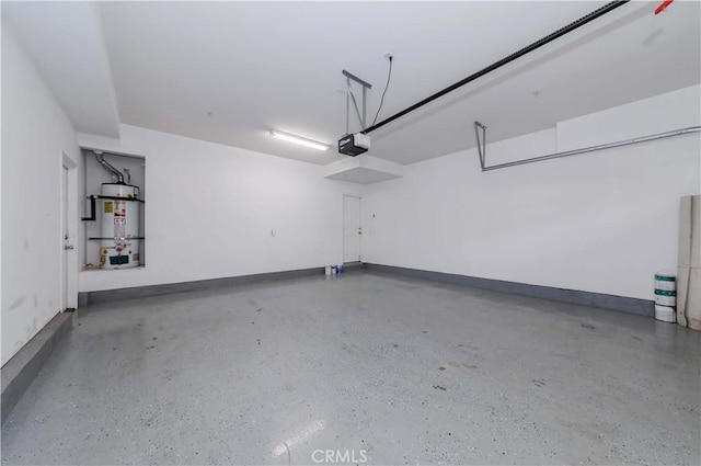 5612 Sprague Ave, Cypress, CA 90630 - garage featuring strapped water heater, a garage door opener, and baseboards