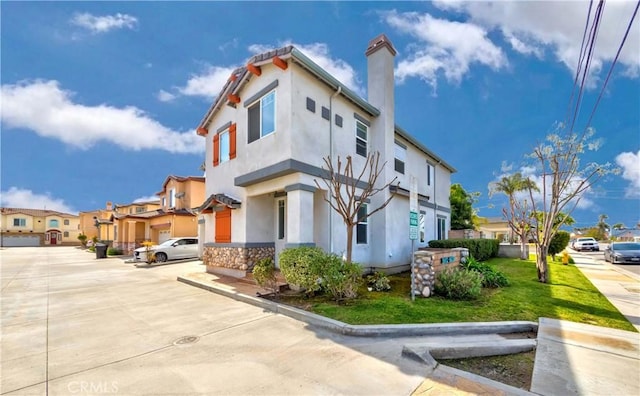 5612 Sprague Ave, Cypress, CA 90630 - view of front of house featuring a residential view, stucco siding, and a chimney