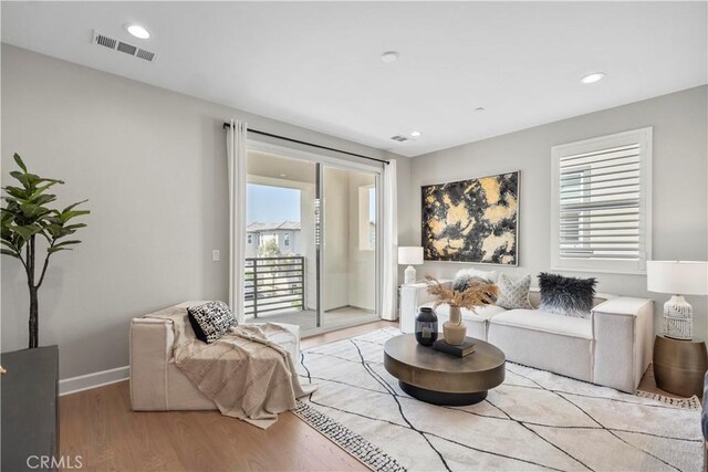 370 Sawbuck, Irvine, CA 92618 - living area featuring light wood-style flooring, baseboards, and recessed lighting