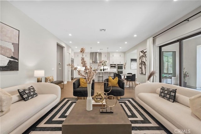370 Sawbuck, Irvine, CA 92618 - living area with light wood-style flooring and recessed lighting