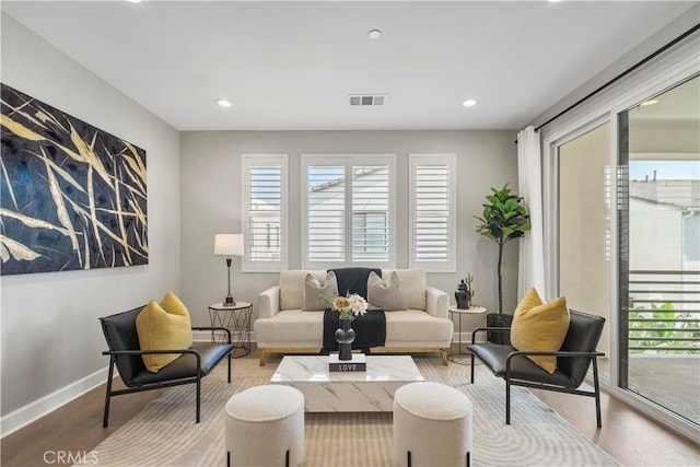 370 Sawbuck, Irvine, CA 92618 - living area featuring plenty of natural light, light wood-type flooring, recessed lighting, and baseboards