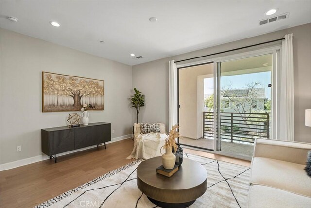 370 Sawbuck, Irvine, CA 92618 - living room featuring light wood-style flooring, baseboards, and recessed lighting
