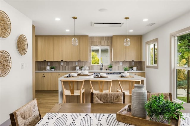 5161 E 27th St, Long Beach, CA 90815 - kitchen featuring light countertops, light brown cabinetry, backsplash, and recessed lighting