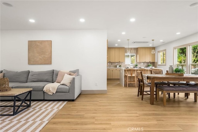 5161 E 27th St, Long Beach, CA 90815 - living room featuring recessed lighting, light wood finished floors, and healthy amount of natural light