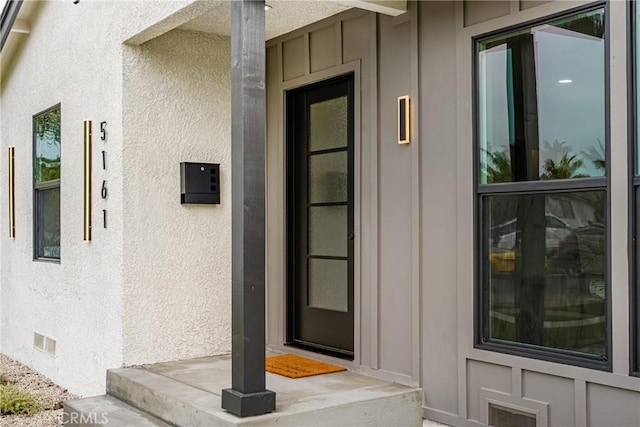 5161 E 27th St, Long Beach, CA 90815 - doorway to property with crawl space, board and batten siding, and stucco siding