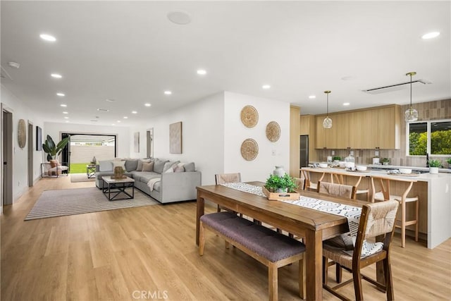 5161 E 27th St, Long Beach, CA 90815 - dining room featuring light wood-style flooring and recessed lighting