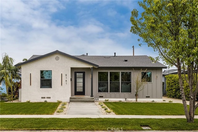 5161 E 27th St, Long Beach, CA 90815 - view of front of house with board and batten siding, a front lawn, crawl space, and roof with shingles