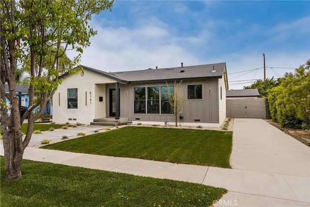 5161 E 27th St, Long Beach, CA 90815 - view of front of property with board and batten siding, a front lawn, and crawl space