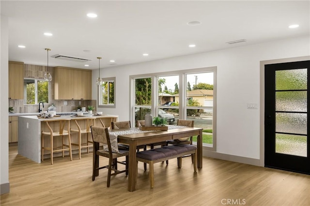 5161 E 27th St, Long Beach, CA 90815 - dining space with light wood-style floors and recessed lighting