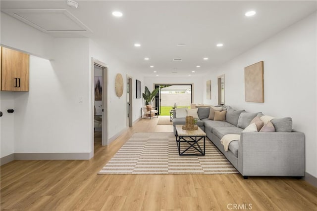 5161 E 27th St, Long Beach, CA 90815 - living area with light wood-style floors and recessed lighting