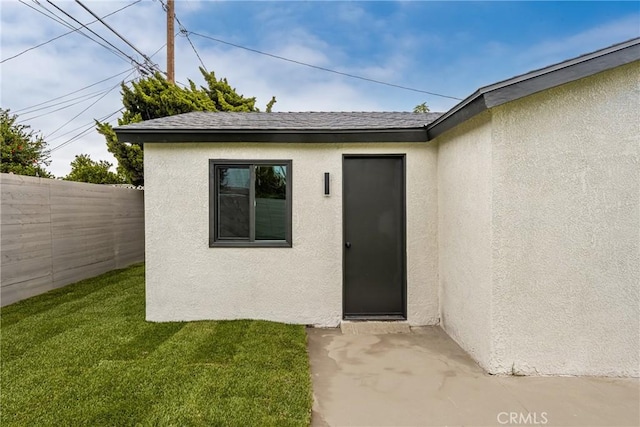 5161 E 27th St, Long Beach, CA 90815 - property entrance with stucco siding and roof with shingles