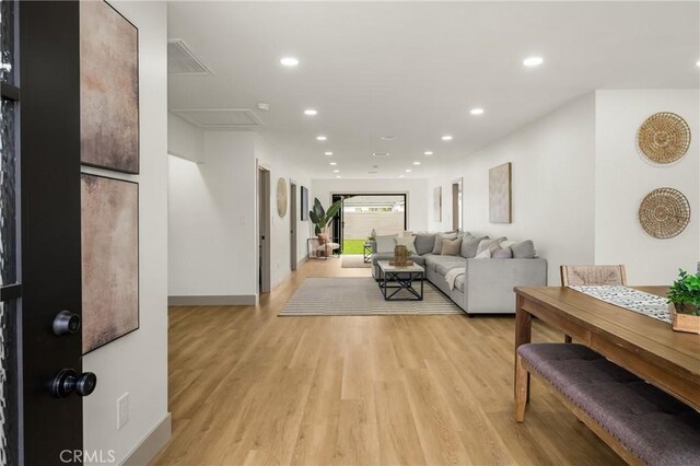 5161 E 27th St, Long Beach, CA 90815 - living area with light wood-style floors and recessed lighting