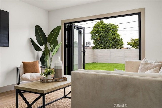 5161 E 27th St, Long Beach, CA 90815 - sitting room with healthy amount of natural light and light wood-style floors