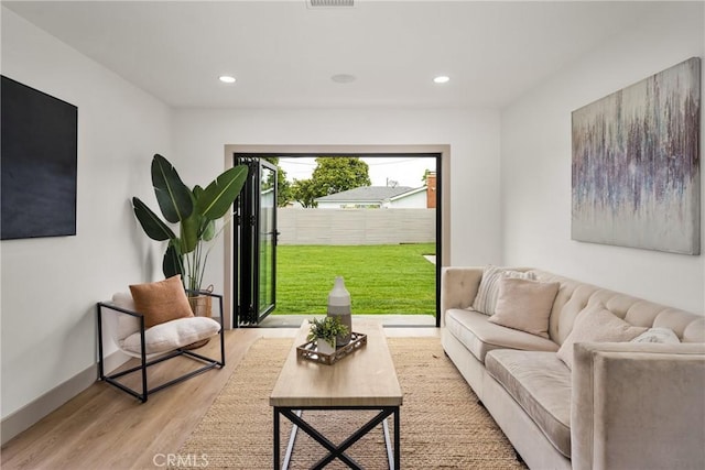 5161 E 27th St, Long Beach, CA 90815 - living room featuring light wood-type flooring and recessed lighting