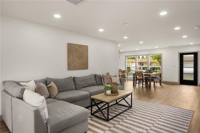 5161 E 27th St, Long Beach, CA 90815 - living room featuring recessed lighting and light wood-type flooring