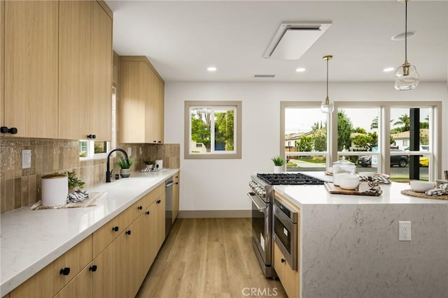 5161 E 27th St, Long Beach, CA 90815 - kitchen featuring appliances with stainless steel finishes, healthy amount of natural light, light wood-style floors, light brown cabinets, and recessed lighting