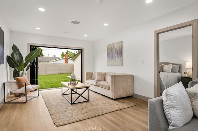 5161 E 27th St, Long Beach, CA 90815 - living area featuring wood finished floors and recessed lighting