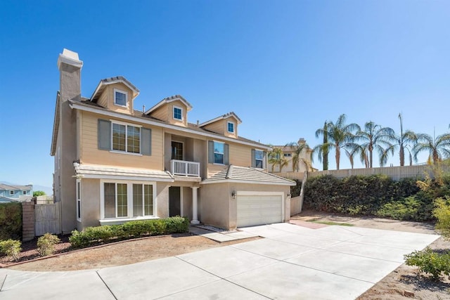 18 Via Palmieki Ct, Lake Elsinore, CA 92532 - view of front of property with a chimney, an attached garage, concrete driveway, and stucco siding