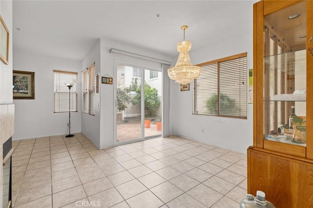 69 Serena Way, Stanton, CA 90680 - unfurnished dining area with plenty of natural light, a chandelier, and light tile patterned floors