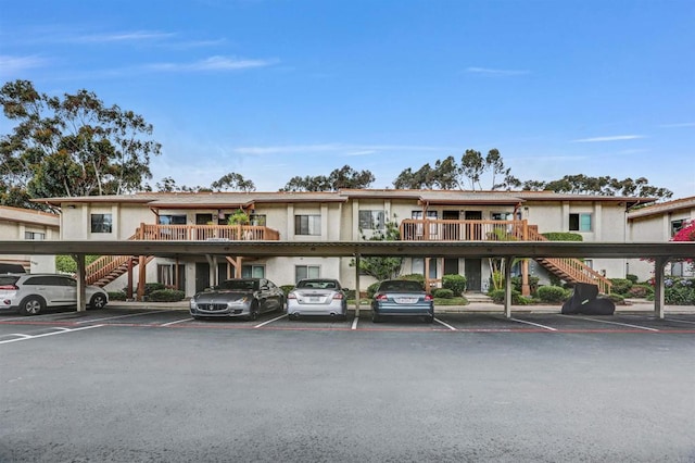 6362 Rancho Mission Rd Unit 712, San Diego, CA 92108 - view of building exterior featuring stairway and covered parking
