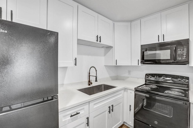6362 Rancho Mission Rd Unit 712, San Diego, CA 92108 - kitchen featuring black appliances, a sink, white cabinets, and light countertops