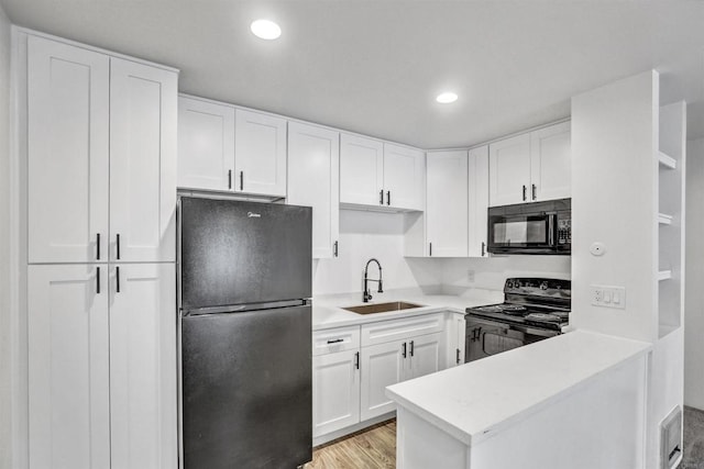 6362 Rancho Mission Rd Unit 712, San Diego, CA 92108 - kitchen with black appliances, a sink, white cabinetry, light countertops, and recessed lighting