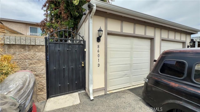 8601 Burnet Ave Unit D, North Hills, CA 91343 - garage featuring a gate