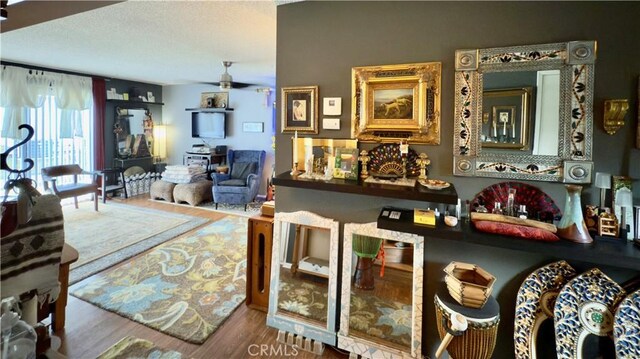 8601 Burnet Ave Unit D, North Hills, CA 91343 - living area with wood finished floors and a ceiling fan